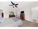 Bedroom features a ceiling fan, TV, and an ensuite bathroom for convenience at 2988 Rivergreen Se Ln, Atlanta, GA 30339
