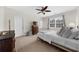 Bright bedroom features a ceiling fan, a window, and closet at 2988 Rivergreen Se Ln, Atlanta, GA 30339