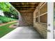 Brick patio underneath a deck with view of the lawn at 2988 Rivergreen Se Ln, Atlanta, GA 30339