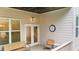 Open porch with outdoor seating including a loveseat, table, and two chairs at 2988 Rivergreen Se Ln, Atlanta, GA 30339