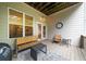 Outdoor porch with a seating arrangement including a loveseat, table, and two chairs at 2988 Rivergreen Se Ln, Atlanta, GA 30339