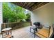 Covered porch area with comfortable seating and a grill, perfect for outdoor entertaining at 2988 Rivergreen Se Ln, Atlanta, GA 30339