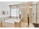 Bright bathroom featuring a soaking tub and separate glass shower at 3351 Cumberland Club Dr # 17, Atlanta, GA 30339