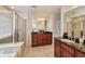 Luxurious main bathroom offers a glass enclosed shower and double vanity sinks at 3351 Cumberland Club Dr # 17, Atlanta, GA 30339