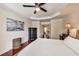 Serene bedroom showcasing a tray ceiling, wood floors and ample natural light at 3351 Cumberland Club Dr # 17, Atlanta, GA 30339