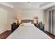 Inviting bedroom features a tray ceiling and warm, ambient lighting for a relaxing atmosphere at 3351 Cumberland Club Dr # 17, Atlanta, GA 30339