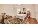 Bright bedroom with neutral walls, area rug, and hardwood floors at 3351 Cumberland Club Dr # 17, Atlanta, GA 30339