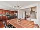 Dining room with hardwood floors next to the kitchen featuring stainless appliances at 3351 Cumberland Club Dr # 17, Atlanta, GA 30339