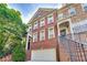 Inviting brick townhome with a two-car garage and well-maintained landscaping at 3351 Cumberland Club Dr # 17, Atlanta, GA 30339