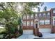 Beautiful brick townhome with a two-car garage and manicured front garden at 3351 Cumberland Club Dr # 17, Atlanta, GA 30339