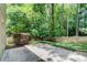 Backyard with concrete patio and a lush green landscape at 4140 Candler Lake West Ne, Atlanta, GA 30319