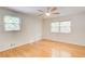 Inviting bedroom with hardwood floors, ceiling fan, and windows at 4140 Candler Lake West Ne, Atlanta, GA 30319