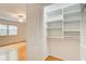 Well-organized closet with shelves and ample storage space adjacent to the bedroom at 4140 Candler Lake West Ne, Atlanta, GA 30319