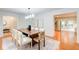 Spacious dining room boasts hardwood floors, stylish decor, and seamless flow to the kitchen at 4140 Candler Lake West Ne, Atlanta, GA 30319