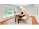 Elegant dining room features large window, hardwood floors, and stylish decor at 4140 Candler Lake West Ne, Atlanta, GA 30319