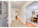 Welcoming entryway with tiled floor, opening to a dining room and kitchen with white cabinets at 4140 Candler Lake West Ne, Atlanta, GA 30319