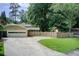 Charming home featuring an attached garage and fenced yard with play equipment at 4140 Candler Lake West Ne, Atlanta, GA 30319