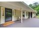 Inviting covered front porch featuring seating, decorative windows, and charming architectural details at 4140 Candler Lake West Ne, Atlanta, GA 30319
