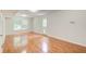 Spacious living room with hardwood floors, large window, and neutral paint at 4140 Candler Lake West Ne, Atlanta, GA 30319