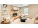 Bright living room features brick fireplace and built-in bookcases at 4140 Candler Lake West Ne, Atlanta, GA 30319