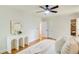 Main bedroom features hardwood floors, ceiling fan, walk in closet, and modern decor at 4140 Candler Lake West Ne, Atlanta, GA 30319