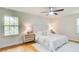 Comfortable main bedroom features hardwood floors, white rug, and great natural light at 4140 Candler Lake West Ne, Atlanta, GA 30319