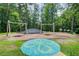 Community playground featuring swings, a bridge, and a decorative flower ground design at 4140 Candler Lake West Ne, Atlanta, GA 30319