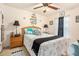 Charming bedroom with a comfy bed, stylish decor, natural light, and ceiling fan, creating a serene retreat at 461 Mountain View Ln, Woodstock, GA 30188