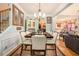 Elegant dining area with stylish furnishings, hardwood floors, and abundant natural light at 461 Mountain View Ln, Woodstock, GA 30188
