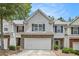 Charming townhome with a two-car garage and well-maintained landscaping at 461 Mountain View Ln, Woodstock, GA 30188