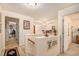 Bright hallway featuring neutral walls, carpet, and staircase; leads to various rooms with an inviting and open atmosphere at 461 Mountain View Ln, Woodstock, GA 30188