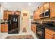 Modern kitchen with stainless steel appliances, granite countertops, and ample cabinet space at 461 Mountain View Ln, Woodstock, GA 30188