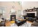 Bright living room with tall ceilings, fireplace, hardwood floors, and comfortable seating at 461 Mountain View Ln, Woodstock, GA 30188