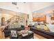 Open-concept living room with hardwood floors, comfortable seating, and a view of the dining area at 461 Mountain View Ln, Woodstock, GA 30188