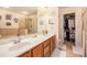 Spacious main bathroom with double sinks, a walk-in closet, and a tiled shower, offering convenience and style at 461 Mountain View Ln, Woodstock, GA 30188
