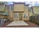 A view of the back exterior of the home with siding and a concrete patio space at 718 Surrey Park Se Pl, Smyrna, GA 30082