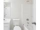 Cozy white bathroom with essential fixtures, tub, shower and sink basin at 718 Surrey Park Se Pl, Smyrna, GA 30082