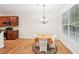 Dining area with wood floors and access to the kitchen, ready for dinner at 718 Surrey Park Se Pl, Smyrna, GA 30082