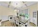 Elegant dining room with coffered ceiling, modern chandelier, and large windows at , Kennesaw, GA 30152