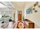 Bright, welcoming foyer features a decorative front door, bench seating, hardwood floors and a floral rug at , Kennesaw, GA 30152