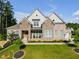 Charming two-story home featuring a landscaped front yard and a mix of stone and brick exterior at , Kennesaw, GA 30152