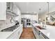 Modern kitchen features stainless steel appliances, an island, quartz countertops, and white cabinets at , Kennesaw, GA 30152
