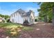 Expansive backyard featuring mature trees and green space, perfect for relaxation and play at 1250 Parkview Nw Ln, Kennesaw, GA 30152
