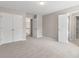 Comfortable bedroom with access to a bathroom and hallway, creating a private and versatile space at 1250 Parkview Nw Ln, Kennesaw, GA 30152
