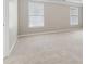 Large bedroom featuring neutral paint, plush carpeting, and plenty of natural light through large windows at 1250 Parkview Nw Ln, Kennesaw, GA 30152
