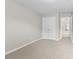 Well-lit bedroom featuring neutral walls, carpet, and a closet, perfect for relaxation and organization at 1250 Parkview Nw Ln, Kennesaw, GA 30152
