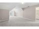 Expansive bonus room with soft carpet, and bright natural light creating a versatile space for various activities at 1250 Parkview Nw Ln, Kennesaw, GA 30152