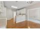 Open kitchen featuring hardwood floors, breakfast bar, and ample cabinet space at 1250 Parkview Nw Ln, Kennesaw, GA 30152