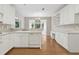 Spacious kitchen with white cabinetry, stone countertops, and stainless steel dishwasher at 1250 Parkview Nw Ln, Kennesaw, GA 30152