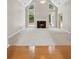 Spacious living room with a fireplace, large windows, and plush carpet at 1250 Parkview Nw Ln, Kennesaw, GA 30152